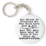 House Is Protected By The Good Lord And A Gun keychains