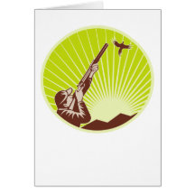 hunter aiming shotgun rifle at pheasant bird card