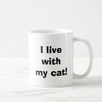 I live with my cat! mugs