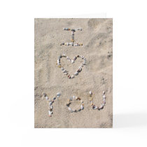 I LOVE YOU written in sea shells in the sand Greeting Cards