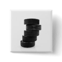 Ice hockey pucks... button