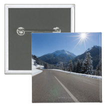 Idyllic empty road thrugh a winter landscape, pins