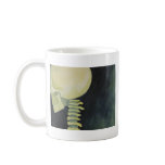 iridescent glowing skull and spinal cord mugs