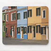 Italy, Burano. Colourful row of homes and empty Mouse Mats