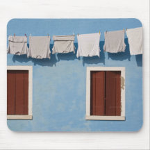 Italy, Burano. Hanging laundry and windows along Mousemat