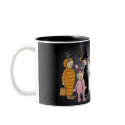 Kids in Halloween costumes. mugs