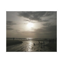 Kids playing at beach during sunset gallery wrapped canvas