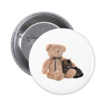kitten in the arms of a teddy bear badges
