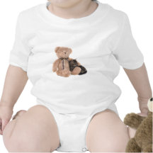 kitten in the arms of a teddy bear barboteuse