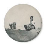 lady kneeling and 2 dogs top of mountain magnet