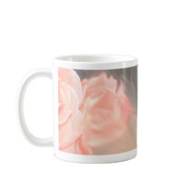 Light pink rose reflection in silver mug