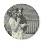 Little girl holding her dog magnet