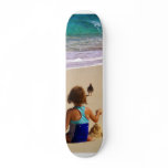 Little Girl Playing in Sand skateboards