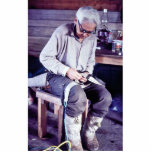 Local resident working on dog sled harness photo sculptures