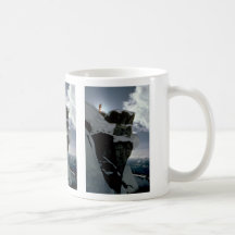 Lone snow skier on top of large rock edge Winter Coffee Mug