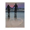 Lovers Holding Hands Walking into the Beach Sunset postcards