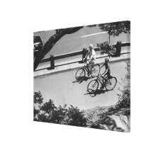 Man and Boy Cycling Stretched Canvas Print