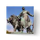 Man and lion statues buttons