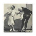 man kissing hand of child holding parasol magnets