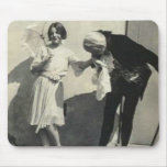 man kissing hand of child holding parasol mousepads