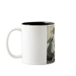 man kissing hand of child holding parasol mugs
