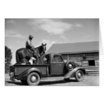 Man on a horse with a dog in a truck cards