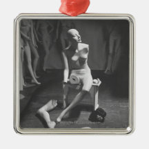 Mannequin with leg and arm removed christmas ornament