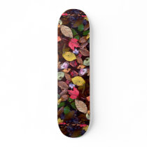 Maple and beech leaves in a pond skate deck
