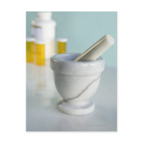 Mortar and pestle, pill bottles in background postcards