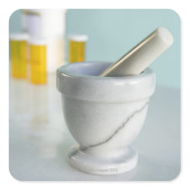 Mortar and pestle, pill bottles in background stickers