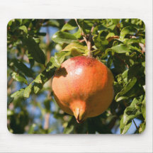 Mousepad with pomegranate's fruit.