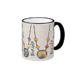 Mug with brightly coloured beads