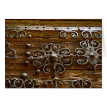 Norman iron scroll work on wooden door greeting card