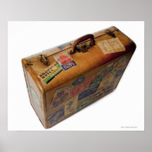 old fashioned suitcase with travel stickers posters