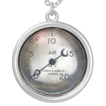 Old pressure gauge from a vintage racing car necklaces