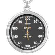 old speedometer gauge from a vintage race car pendant
