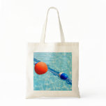 Orange beach ball in a swimming pool bags