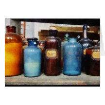 Orange, Brown and Blue Bottles of Chemicals Cards