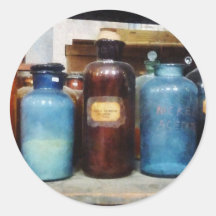 Orange, Brown and Blue Bottles of Chemicals Sticker