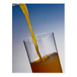 Orange juice poured into glass postcard