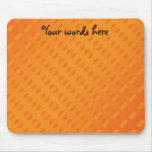 Orange polka dots on orange background mouse pads