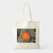 Orange Pumpkin on table - top view Canvas Bags