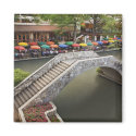 Outdoor cafe along River Walk and bridge over 2 magnets