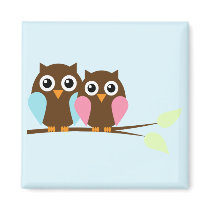 Owl couple on a branch