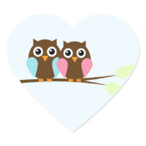 Owl couple on a branch