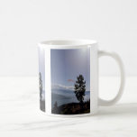 Paraglider flying over valley lake mug