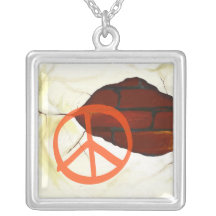 Peace symbol on wall, necklace