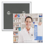 Pharmacist holding prescription in drug store pin