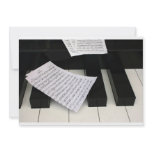 Piano keys with music invitations
