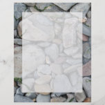 Picture of stones on a beach. flyer design